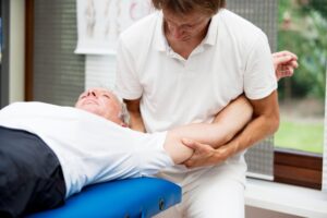 Man getting urgent chiropractic care at Sandusky Wellness Center in Ohio